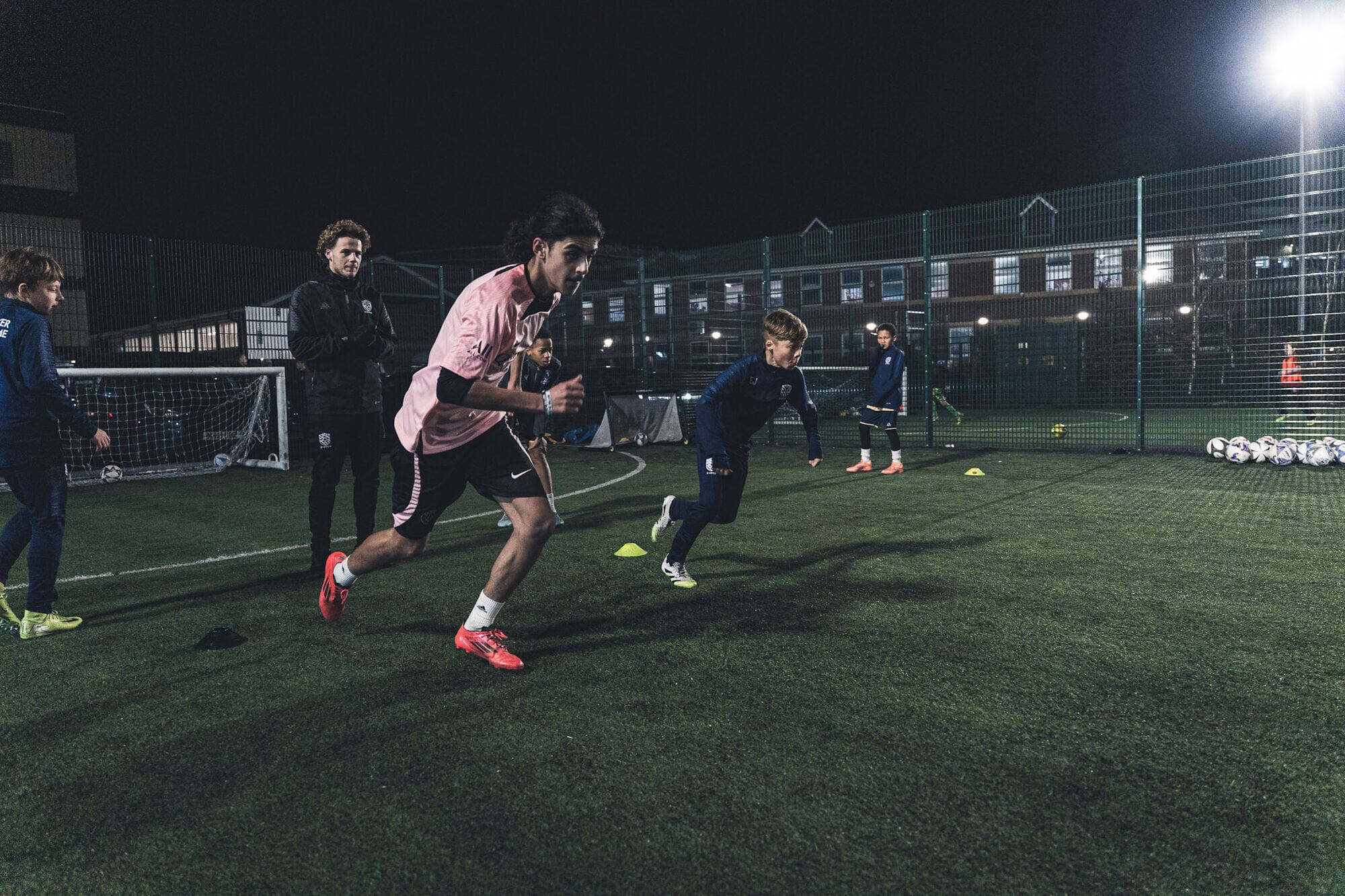 E-PPRO players in a floodlit speed and agility drill
