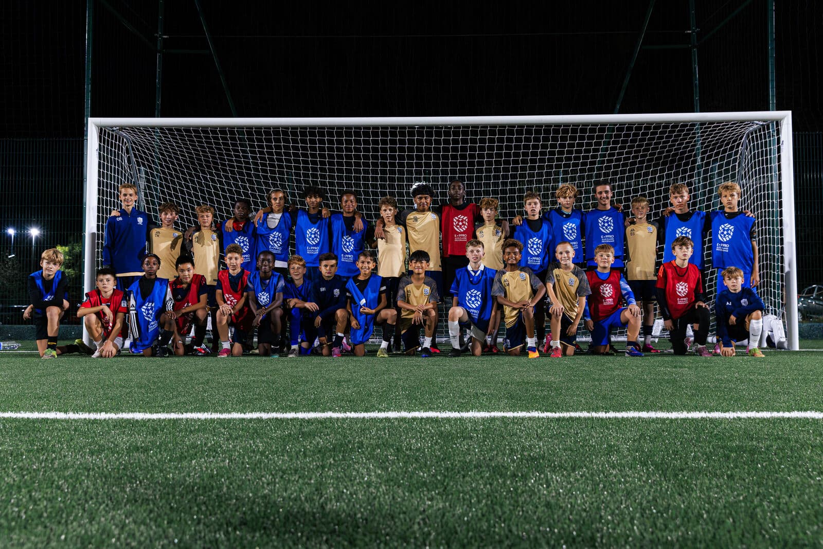 E-PPRO players lined up in front of the goal under floodlights