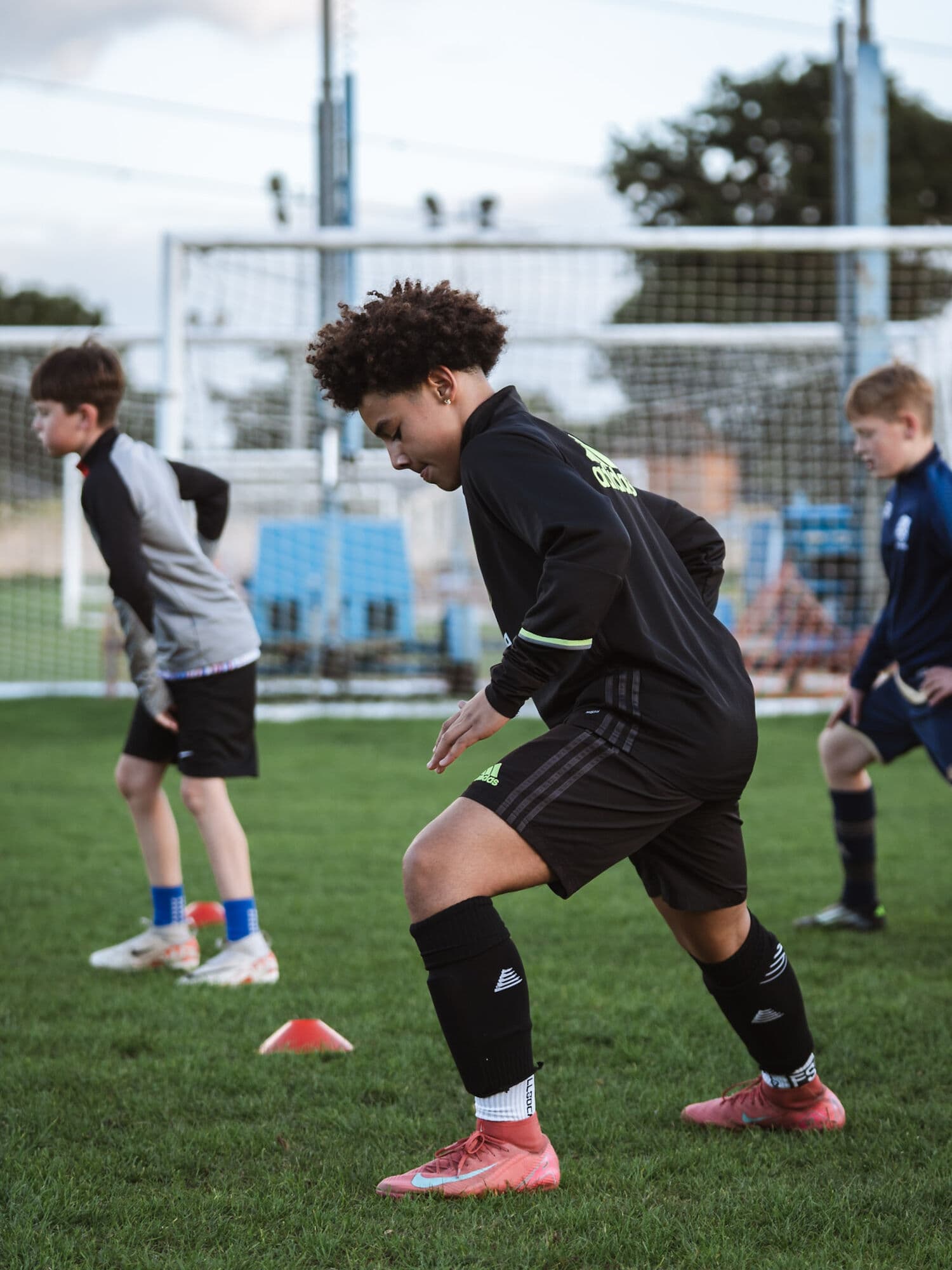 E-PPRO players in an agility and conditioning drill through cones