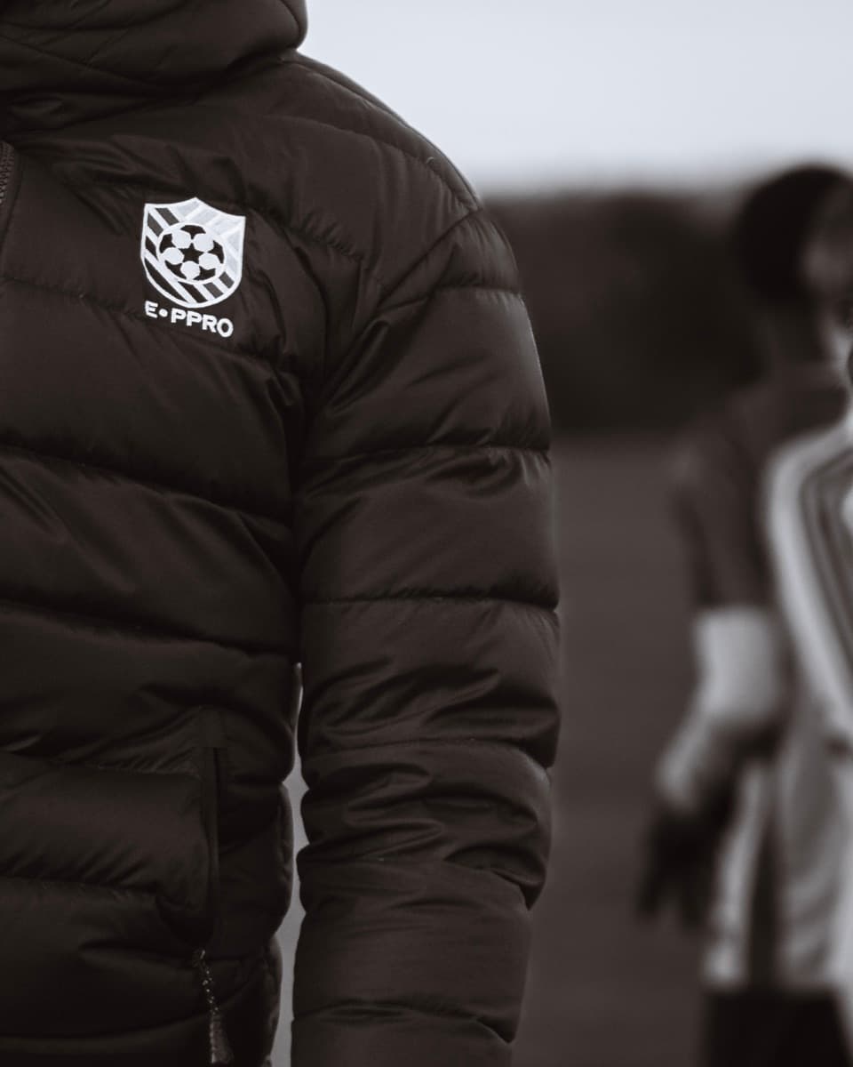 E-PPRO coach in branded kit at a session